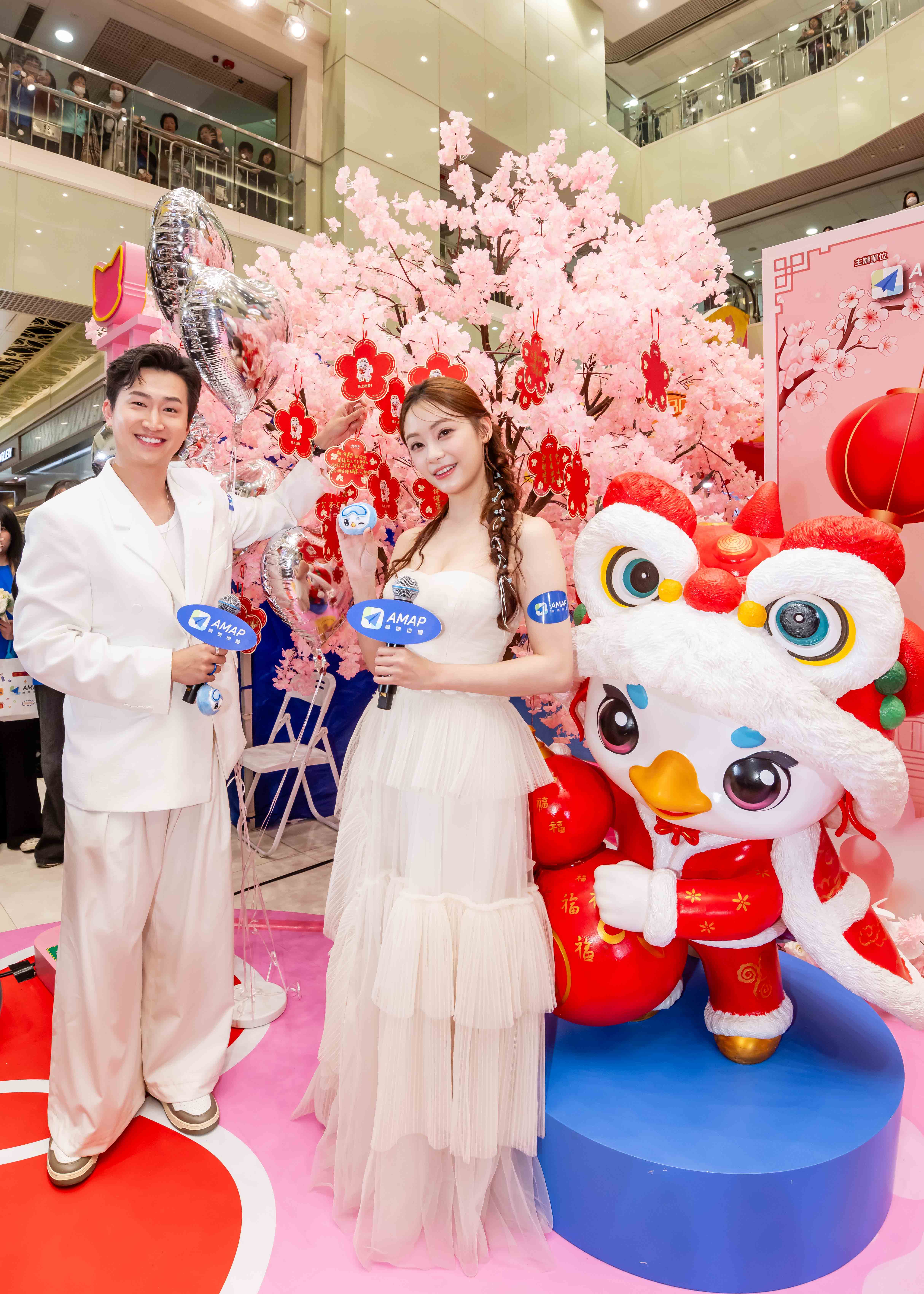 Crowded AMAP in-mall launch event with attendees and media